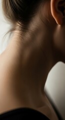 Close-up of a woman's neck and ear with soft lighting skin human