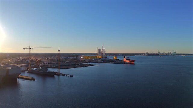 Aerial view of Norfolk wind terminal and port coastline during sunset