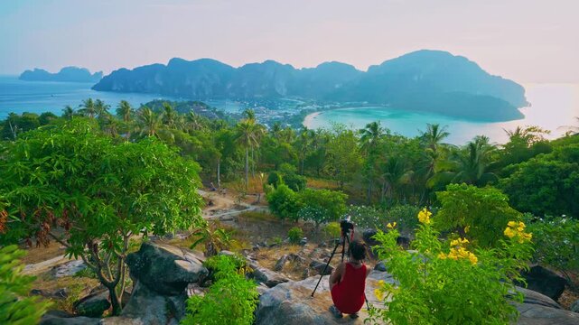 Woman enjoying breathtaking view of stunning phi phi island surrounded by crystal clear waters