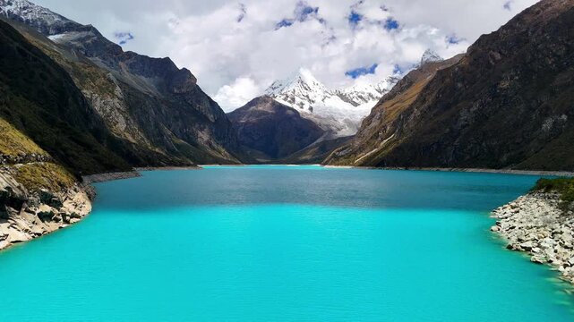 Stunning aerial view of the turquoise waters of Laguna Par&oacute;n, with snow-capped peaks of the Cordillera Blanca in Huaraz, Peru.