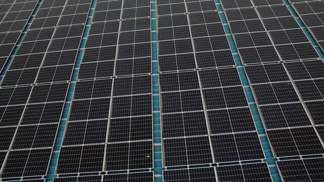Macro Texture of Polycrystalline Silicon Solar Cell showing Photovoltaic Wafer Grid and Sun Flare Reflection for Clean Energy Technology