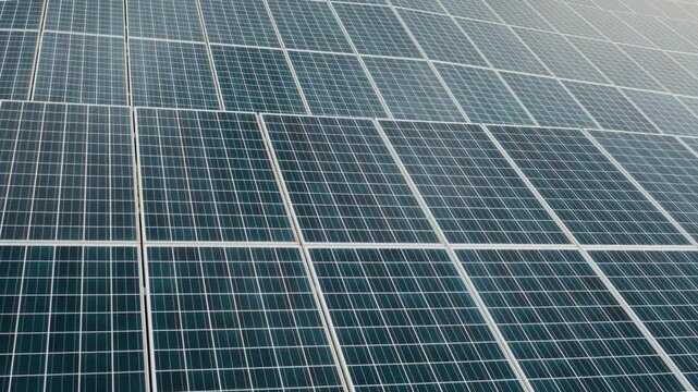 Macro Texture of Polycrystalline Silicon Solar Cell showing Photovoltaic Wafer Grid and Sun Flare Reflection for Clean Energy Technology