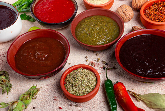 assortment of Georgian sauces and spices, top view, set of spices and tkemali, Georgian, food background,