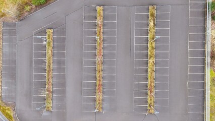 Aerial Top View of Empty Parking Lot with Marked Spaces