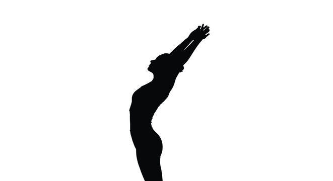 Silhouette of a woman practicing upward salute yoga pose demonstrating back extension and flexibility
