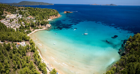 Aerial Wide Panorama of Chrisi Milia Beach turquoise sea and Golden Sands &mdash; Scenic Family Resort with White Houses on Hillside, Alonissos Marine Park Sporades Greece