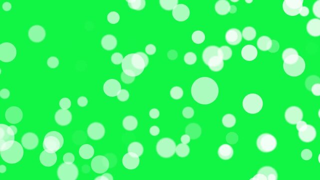 White bokeh particles animation on greeb screen background. white dust bokeh particle effect 4k stock video.