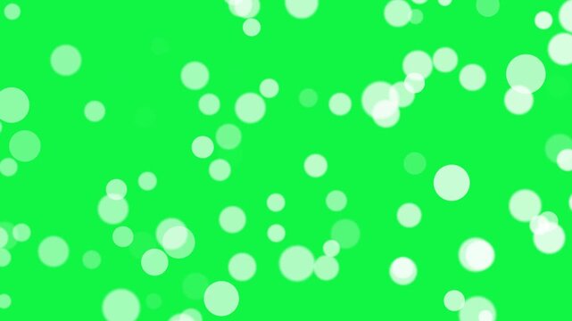 White bokeh particles animation on greeb screen background. white dust bokeh particle effect 4k stock video.