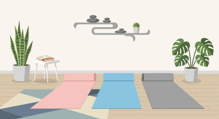 Fototapeta premium Three colorful yoga mats laid out on a wooden floor.