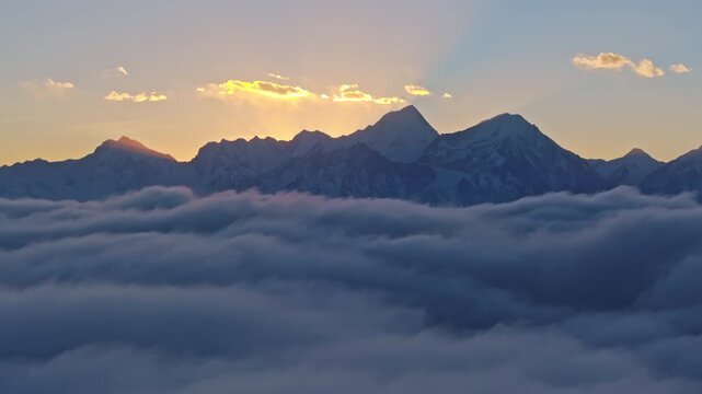 Breathtaking Sunset Glow Over Mount Gongga and Sea of Clouds in Western Sichuan