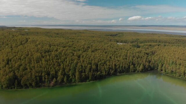 Aerial circle view of Edmonds Lake and surrounding wilderness in Alaska 
