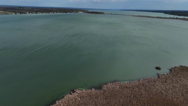 Cayuga Lake glacier finger lake in central New York State with natural wetlands aerial drone view