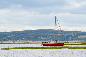 Marshes and boats over Hurst Spit, Milford on Sea, Lymington, Hampshire, England