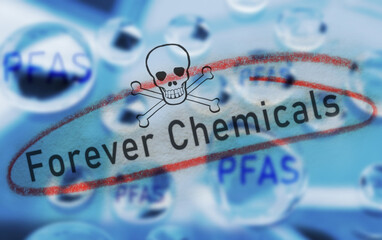 Water drops with PFAS text, warning symbol and Forever Chemicals circled in red -- water contamination concept