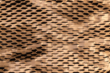 yellow paper with a lot of cuts is used for packaging and decorative purposes, paper with cuts and a lot of holes is used for packaging goods and other purposes