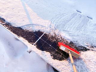 Clean snow off solar panels with a broom. Roof cleaning