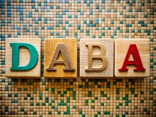 Colorful wooden alphabet blocks spelling daba on mosaic background