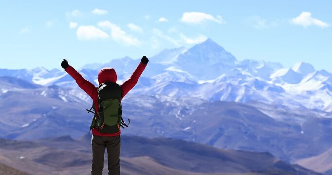 Successful woman hiker open arms to Mount Everest in Tibet, China