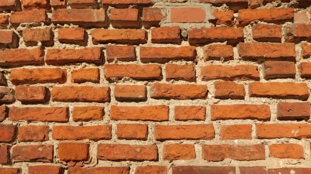 Detailed old masonry with sunlight highlighting textures.
