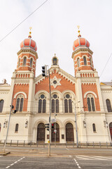 Obraz premium The synagogue building in Pilsen, Czech Republic. The building is photographed from the bottom up