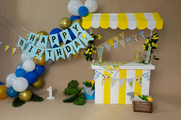 Adorable First Birthday Party Setup with Lemonade Stand and Safari Cake