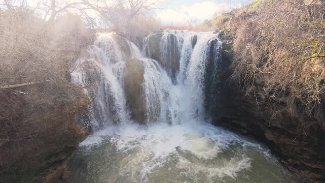 Long exposure shot of the Pozo Redondo waterfall in Calmarza, creating a silky smooth effect on the cascading water as it flows over the mossy rocks in this beautiful natural spot in Zaragoza.