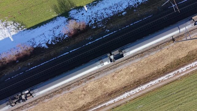 Scenic rail journey in Zurich, train moving across the screen in a diagonal line.