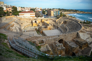Roman amphitheater of Tarragona, Catalonia, Spain, with the Porta Triumphalis in the foreground