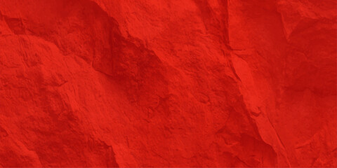 Grungy red paint texture with a crumpled paper design and silk textile pattern creates an old art backdrop for a Valentine or Christmas wall surface