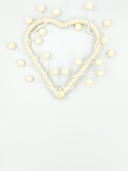 Obraz premium A white heart in the form of a tree with fruits on a white background. Space for the text.