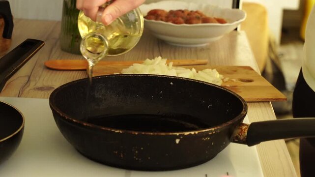 Woman is peeling and cutting garlic for cooking
