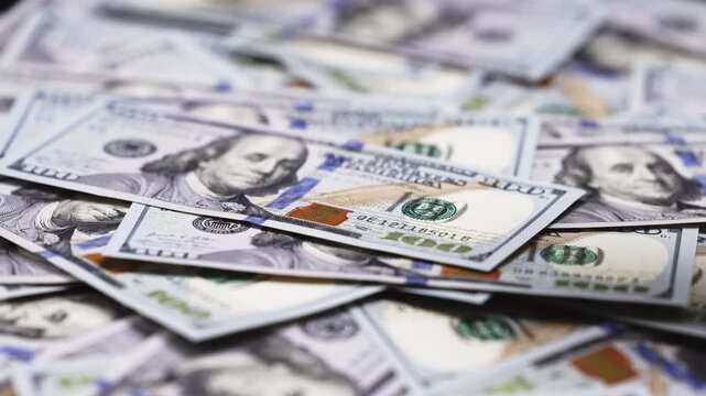 Money and finance concept with hundred dollar bills illustrating income growth, economic success, cash reserves and financial planning.