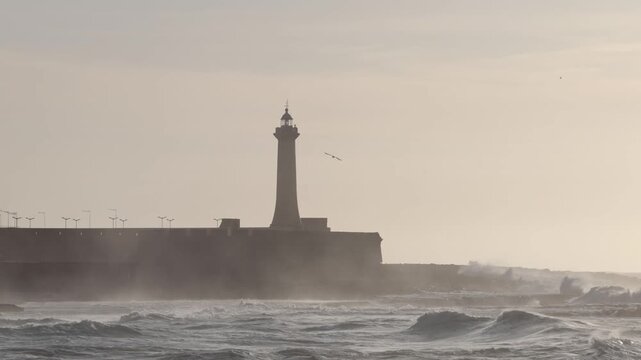Rabat, Morocco Large waves on the Atlantic Ocean roll past the Lighthouse of Rabat. 