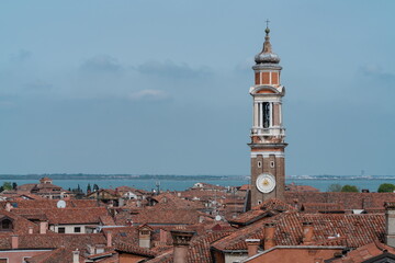 Fototapeta premium Santi Apostoli church bell tower above Venice rooftops, Cannaregio Italy