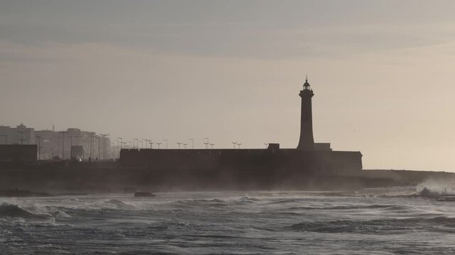 Rabat, Morocco Large waves on the Atlantic Ocean roll past the Lighthouse of Rabat. 