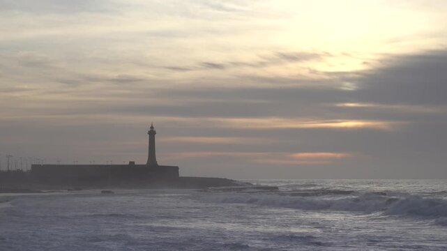 Rabat, Morocco Large waves on the Atlantic Ocean roll past the Lighthouse of Rabat. 