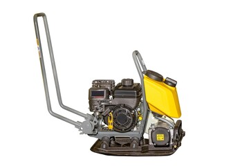 Powerful compactor ready for construction tasks at a building site during the day. Isolated on white background.
