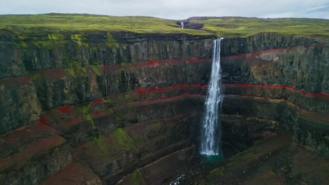Aerial drone view of Hengifoss waterfall landscape in Iceland.