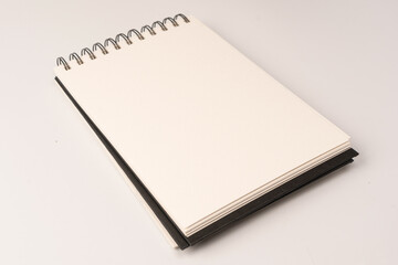 White empty spiral notebook mockup, copy space. Isolated on a white background.