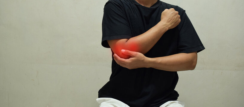 Man suffering from pain in cubit, disease of the elbow joint, bone fracture and inflammation. Health problems concept