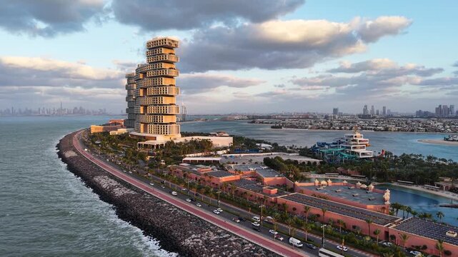 Aerial footage of Palm Jumeirah outer crescent in Dubai at sunset, UAE