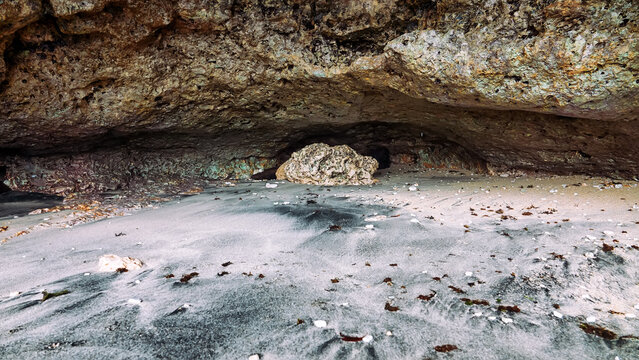 Volcanic island and grotto; grot caves in calcareous rocks and calcareous white sediment. Spice Islands and the Banda Sea