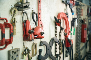 Automotive work tools hanging on a modern wall organizer