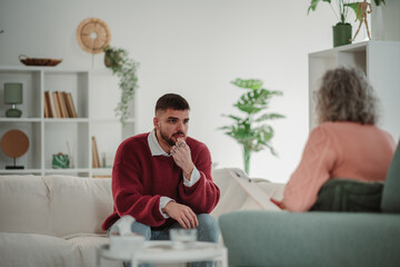 Young man receiving psychotherapy counseling support session