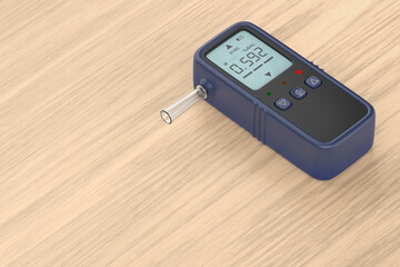 Breathalyzer displaying high alcohol content on wooden desk