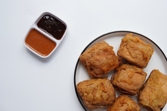 crispy golden brown fried tofu or tahu goreng. indonesian tahu isi deep fried stuffed tofu with vegetables. close-up view of tahu Isi, a popular Indonesian savory snack consisting of tofu filled