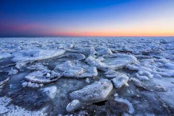 Ice toros on the Baltic Sea beach in Mikoszewo at sunrise. Poland