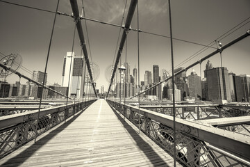 Brooklyn Bridge architectural elements with steel cables and stone towers in Manhattan