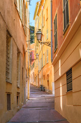 Obraz premium Colorful traditional houses line a narrow street in the Old Town of Nice, France