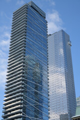 Naklejka premium view of (left) Theatre Park condominium at 224 King St W and (right) south east elevation of Thomson Reuters (19 Duncan St), Toronto
